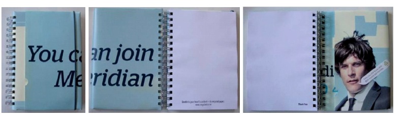 A Meridian Energy recycled poster notebook that says 'You c Me' on the front and then opens up to read in full to say 'You can join Meridian'.